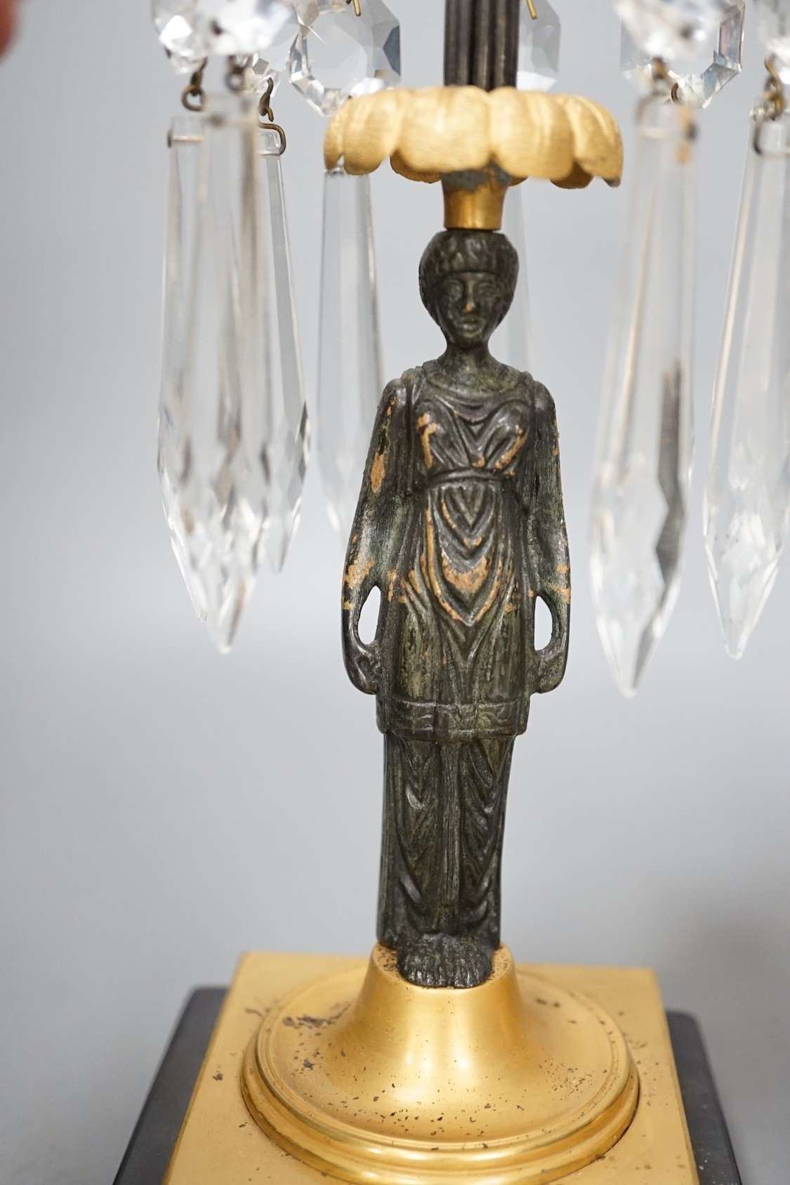 A pair of figural lustre drop candlesticks - 29cm tall